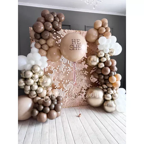 Balloon decoration for Gender party with shimmer backdrop wall Desert